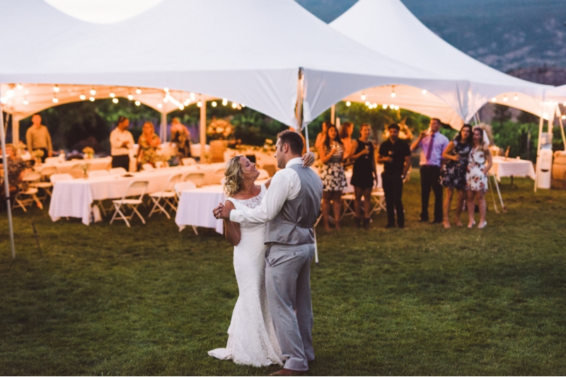 Wedding party on the lawn with a tent at see ya later ranch in okanagan falls