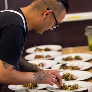 chef prepares dinner at nkmip cellars