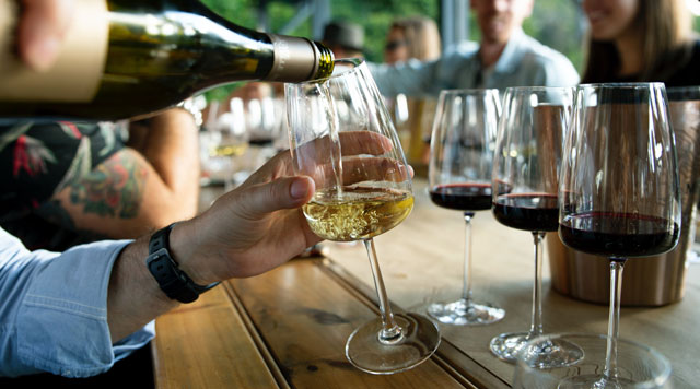 man pouring wine